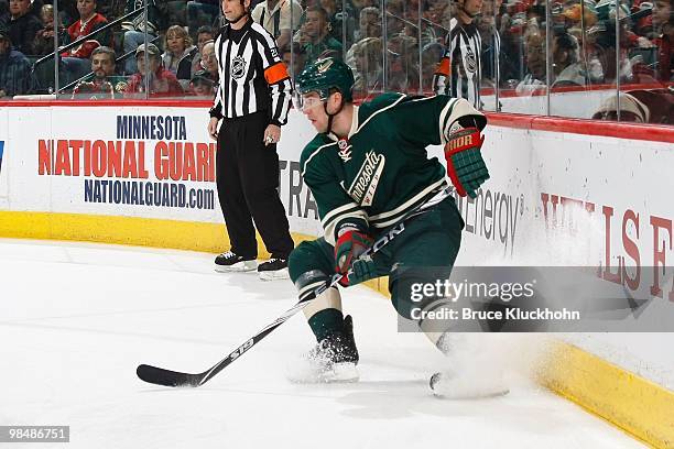 Marek Zidlicky of the Minnesota Wild handles the puck along the boards against the San Jose Sharks during the game at the Xcel Energy Center on April...