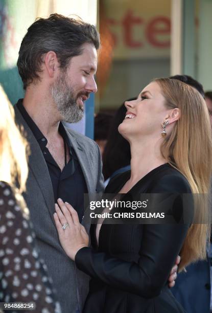 Actress Amy Adams and her husband US actor Darren Le Gallo attend the premiere of the HBO television miniseries "Sharp Objects" at the ArcLight...