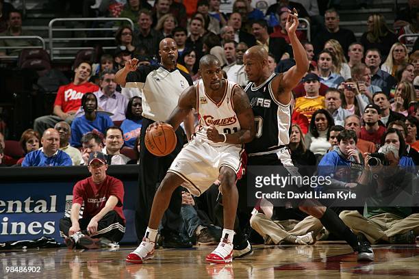 Jawad Williams of the Cleveland Cavaliers moves the ball against Keith Bogans of the San Antonio Spurs during the game at Quicken Loans Arena on...