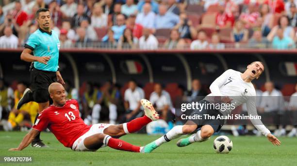 Antoine Griezmann of France is tackled by Mathias Jorgensen of Denmark during the 2018 FIFA World Cup Russia group C match between Denmark and France...