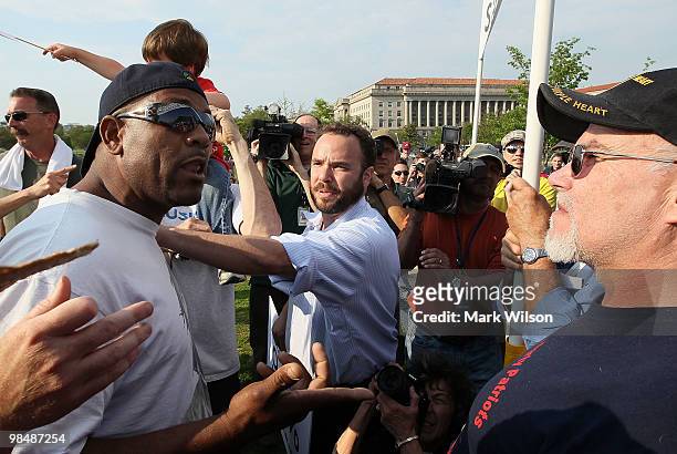 Obama supporter Rick Walker argues his point to Tea Party supporters during a protest on the grounds of the Washington Monument on April 15, 2010 in...