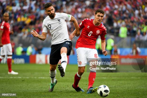 Olivier Giround of France and Andreas Christiansen of Denmark fight for the ball during the 2018 FIFA World Cup Group C match between Denmark and...