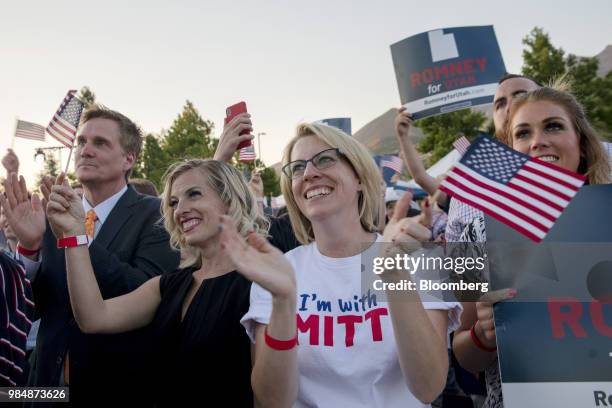 Attendees applaud and wave flags during an election night rally for Mitt Romney, Republican U.S Senate candidate, in Provo, Utah, U.S., on Tuesday,...