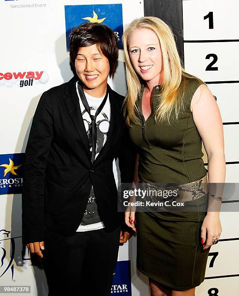 Song-Hee Kim of South Korea and Morgan Pressel of the United States pose for a photo during the Red Carpet "Hollywood" Mojo 6 Kick-off Party...