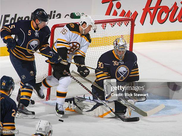 Toni Lydman and Ryan Miller of the Buffalo Sabres defend against Marco Sturm of the Boston Bruins in Game One of the Eastern Conference Quarterfinals...