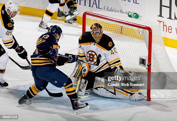 Tyler Ennis of the Buffalo Sabres just misses the net as Tuukka Rask of the Boston Bruins defends in Game One of the Eastern Conference Quarterfinals...