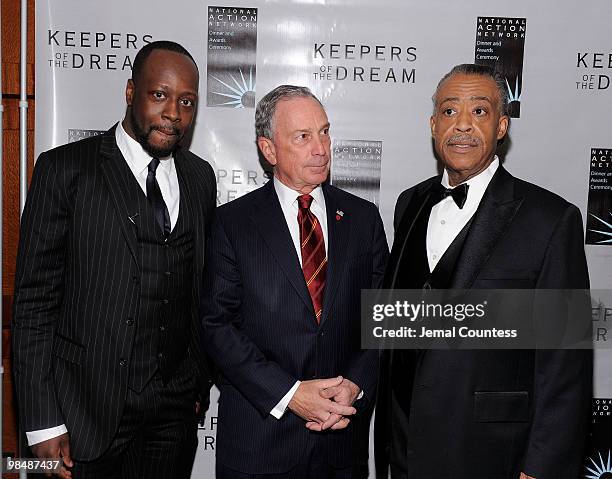 Musician Wyclef Jean, New York City Mayor Michael Bloomberg and Reverend Al Sharpton of the National Action Network share a moment on the red carpet...