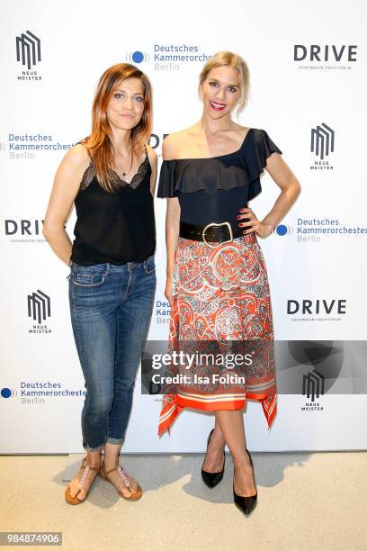 German actress Claudia Eisinger and German actress Julia Dietze during the 8th edition of the Berlin concert series 'Neue Meister' at Volkswagen...