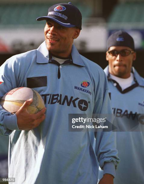 Maurice Greene of the United States and Ato Boldon of Trinidad and Tobago in NSW Waratahs rugby jerseys during the Goodwill Games'' Whirlwind World...