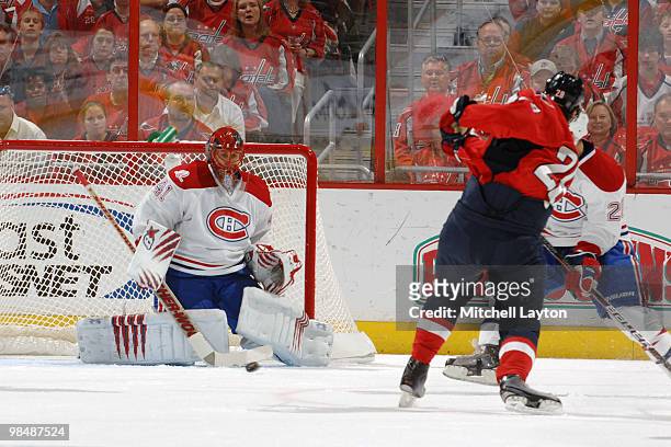 Jaroslav Halak of the Montreal Canadiens makes a save against a shot by Alexander Semin of the Washington Capitals during Game One of the Eastern...
