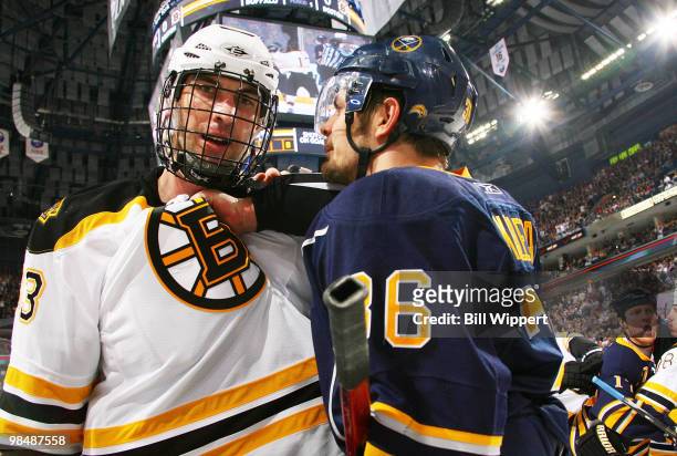 Zdeno Chara of the Boston Bruins and Patrick Kaleta of the Buffalo Sabres exchange words during a first period skirmish at Game One of the Eastern...