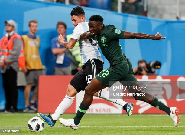 Kenneth Omeruo of Nigeria national team and Cristian Pavon of Argentina national team vie for the ball during the 2018 FIFA World Cup Russia group D...