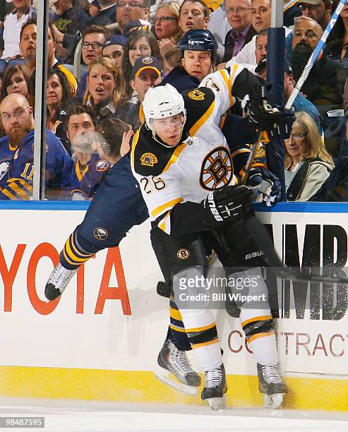Matt Ellis of the Buffalo Sabres and Blake Wheeler of the Boston Bruins collide in Game One of the Eastern Conference Quarterfinals during the 2010...