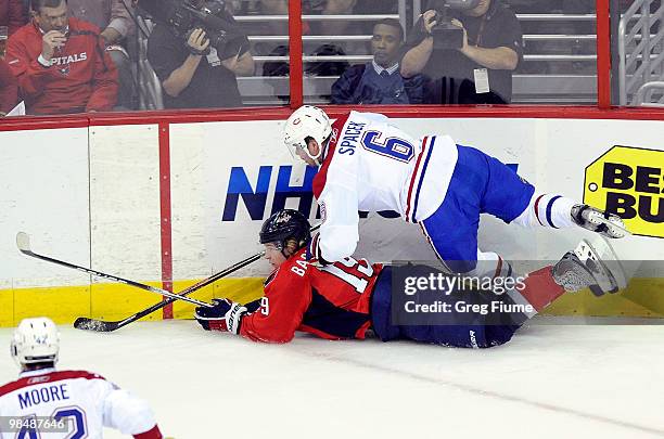 Jaroslav Spacek of the Montreal Canadiens checks Nicklas Backstrom the Washington Capitals in Game One of the Eastern Conference Quarterfinals during...