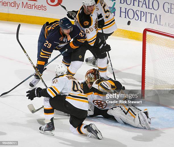 Matt Hunwick, Tuukka Rask and David Krejci of the Boston Bruins defend against Jason Pominville of the Buffalo Sabres in Game One of the Eastern...