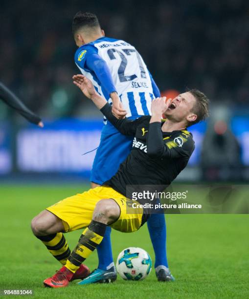 Dortmund's Lukasz Piszczek and Hertha's Davie Selke battle for the beall during the German Bundesliga soccer match between Hertha BSC and Borussia...