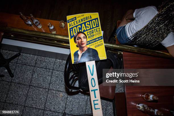 Sign for progressive challenger Alexandria Ocasio-Cortez at her victory party in the Bronx after an upset against incumbent Democratic Representative...