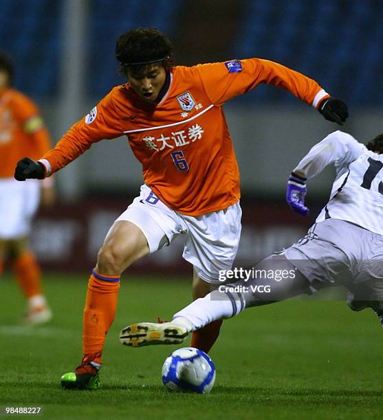 Haibin Zhou of Shandong Luneng aims a ball during the AFC Champions League between Shandong Luneng and Sanfrecce Hiroshima on April 13, 2010 in...