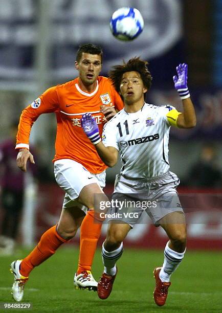Hisato Sato of Sanfrecce Hiroshima competes for a ball during the AFC Champions League between Shandong Luneng and Sanfrecce Hiroshima on April 13,...