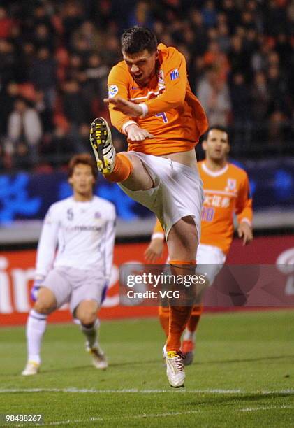 Sinisa Radanovic of China Shandong Luneng aims a ball during the AFC Champions League between Shandong Luneng and Sanfrecce Hiroshima on April 13,...