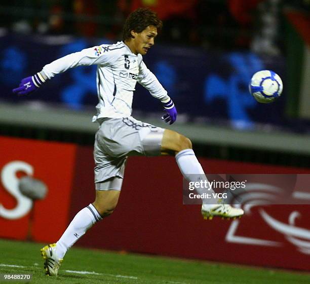 Tomoaki Makino of Sanfrecce Hiroshima aims a ball during the AFC Champions League between Shandong Luneng and Sanfrecce Hiroshima on April 13, 2010...