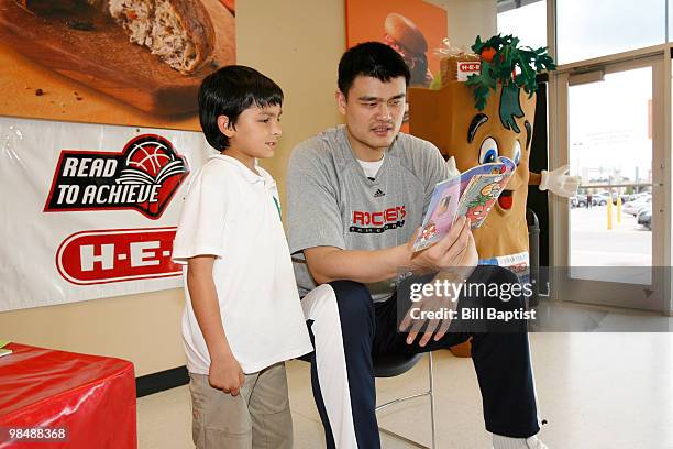 Yao Ming of the Houston Rockets reads to school kids at a local HEB grocery store in Houston, Texas on April 15, 2010 in Houston, Texas. NOTE TO...