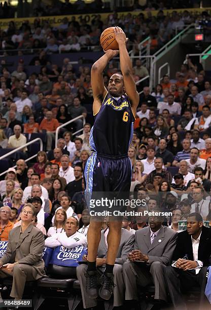 Arron Afflalo of the Denver Nuggets puts up a shot during the NBA game against the Phoenix Suns at US Airways Center on April 13, 2010 in Phoenix,...