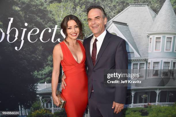 Emmanuelle Vaugier and Vince Calandra attend HBO's Sharp Objects Los Angeles premiere at ArcLight Cinerama Dome on June 26, 2018 in Hollywood,...
