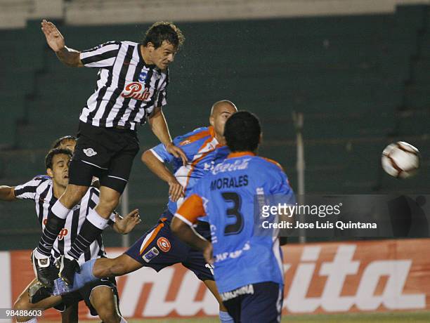Adalberto Roman of Libertad heads the ball to score a goal during a match against Blooming at Ramon Aguilera Costa Stadium on April 15, 2010 in Santa...