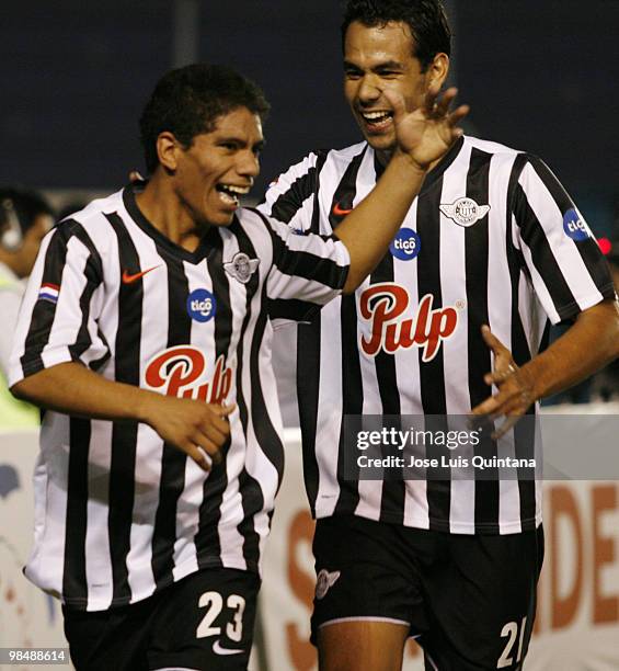 Adolfo Gama and Pedro Velazquez of Libertad celebrate second scored goal during a match against Blooming at Ramon Aguilera Costa Stadium on April 15,...