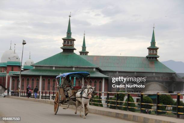 Horse cart can be seen in front of Jamia Masjid in Sopore, of District Baramulla, Jammu and Kashmir, India, on 27 June 2018.