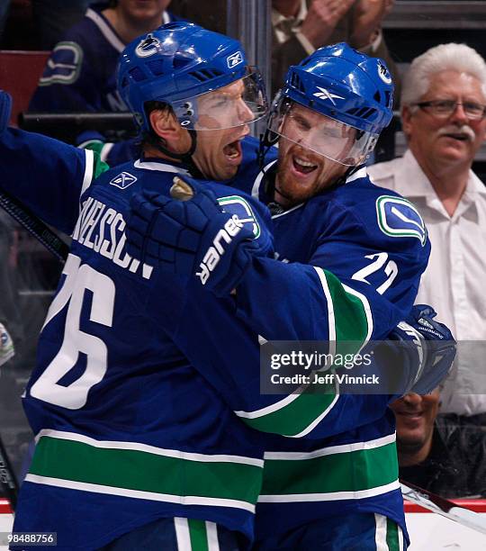 Daniel Sedin and Mikael Samuelsson of the Vancouver Canucks celebrate the Canucks' first goal by Samuelsson in Game One of the Western Conference...