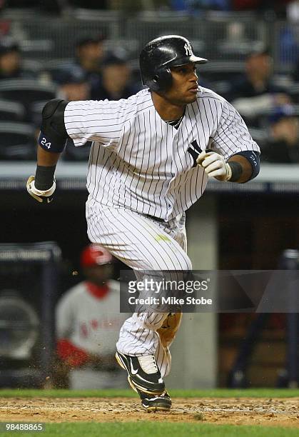 Robinson Cano of the New York Yankees watches his second homerun of the game leave the park against the Los Angeles Angels of Anaheim in the bottom...