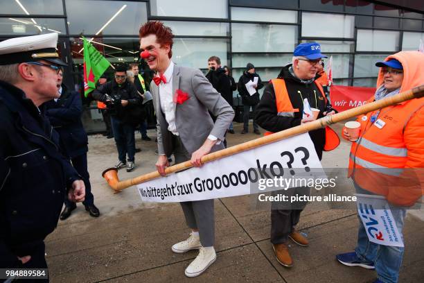 Costumed SPD member holding an alpine horn with the text "#Wo bitte geht's zur Grooooooko??"" at a demonstration in front of the WCCB during the...