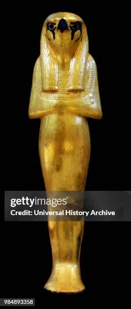 Statuette of Geb. Gilded wood. Faience and glass. Thebes. Valley of the Kings. Tomb of Tutankhamen. 1323 BC. 18th dynasty. New Kingdom.