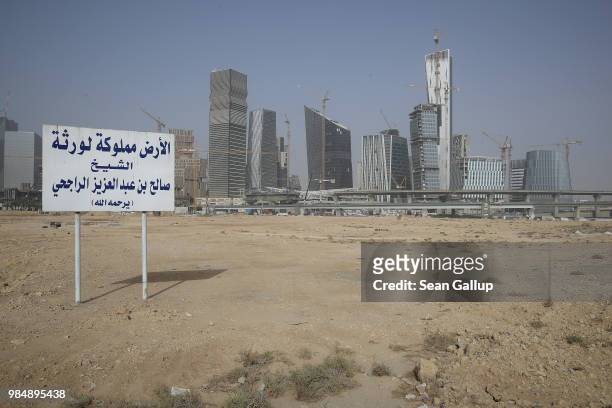 Office buildings stand at the construction site of the new King Abdullah Financial District on June 20, 2018 in Riyadh, Saudi Arabia. The development...
