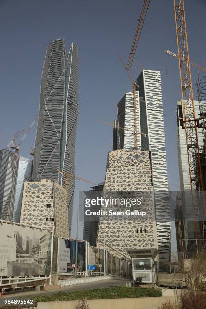 Office buildings stand at the construction site of the new King Abdullah Financial District on June 20, 2018 in Riyadh, Saudi Arabia. The development...