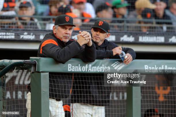 Manager Bruce Bochy of the San Francisco Giants looks on from the dugout during a game against the Colorado Rockies at AT&T Park on Tuesday, June 26,...