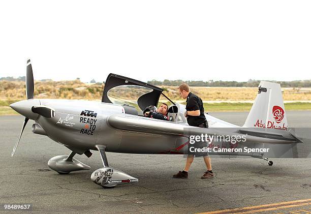 Hannes Arch of Austria talks to team technician Vito Wyprachtiger following his first session during the Red Bull Air Race Training Day Two on April...