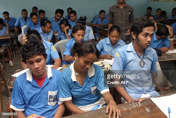To go with AFP story by Matt Crook: TIMOR-WOMEN-EDUCATION-YOUTH-FAMILY Children sit in a classrom in Dili on March 25, 2010. The population of East...