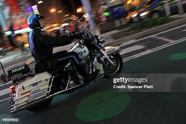 Police officer on a motorcycle patrols in Times Square on April 15, 2010 in New York City. Following a recent melee involving groups of youths around...