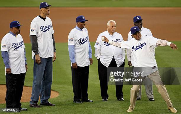 Tommy Davis, Kareem Abdul-Jabbar, Frank Robinson, Tommy Lasorda and Lou Johnson watch Don Newcombe throw out the first pitch prior to the start of...