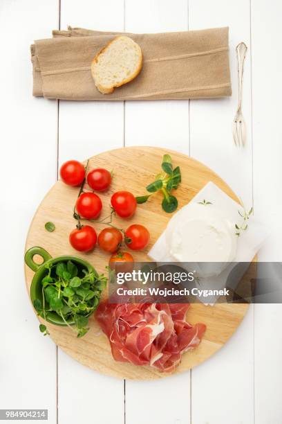 italian food, prosciutto crudo and ricotta cheese on wooden kitchen plank - crudo stock pictures, royalty-free photos & images