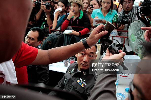 Gun belonging to a Thai policeman is seen at Bangkok commercial district, after being detained by Red shirt supporters during their foiled arrest...