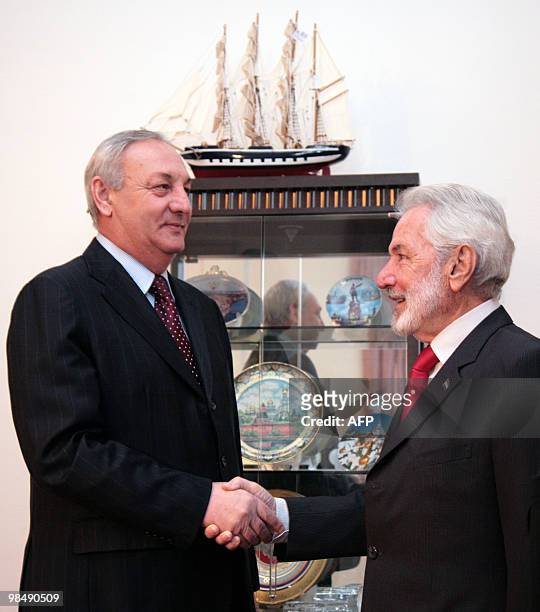 The President of Georgia's breakaway republic of Abkhazia Sergei Bagapsh shakes hands with Foreign Minister of Nicaragua Samuel Santos during their...