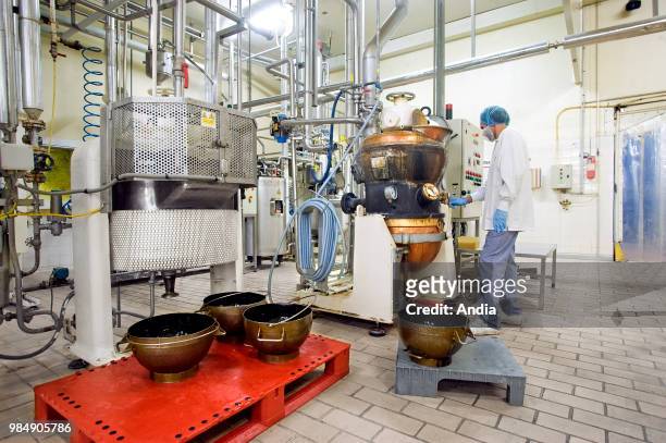 Bondues : production line of the Lutti confectionery factory. Worker in front of a production line.