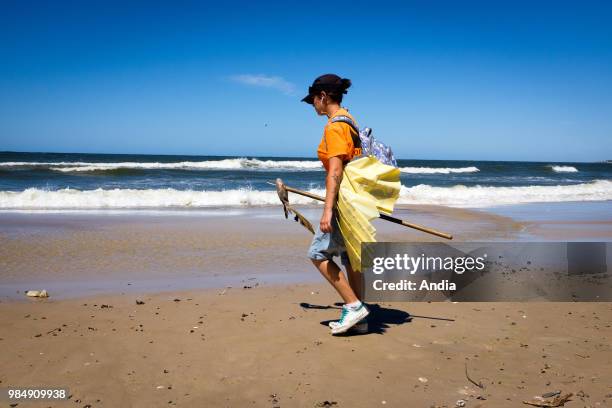 Uruguay, La Floresta, small city and resort on the Costa de Oro . A young woman, hired as a municipal agent, has to clean the beaches, to pick the...