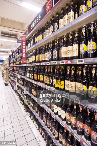 Beer counter in an 'Auchan' hypermarket Poster Saveurs en Or - Notre Terroir. Ch'ti, 3 Monts and Grain d'Orge, beers for keeping; Vivat, Page 24;...