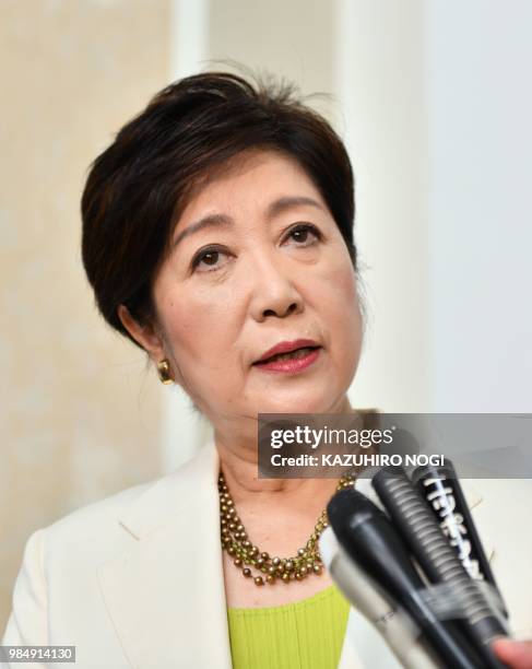 Tokyo governor Yuriko Koike speaks to reporters during a press briefing after a session of the metropolitan assembly in Tokyo on June 27, 2018. -...