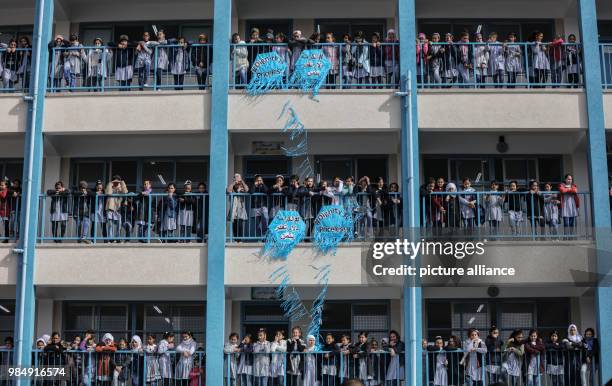 Palestinian school girls watch a press conference by UNRWA Commissioner General Pierre Krahenbuhl during his visit to an UNRWA school in Gaza City,...